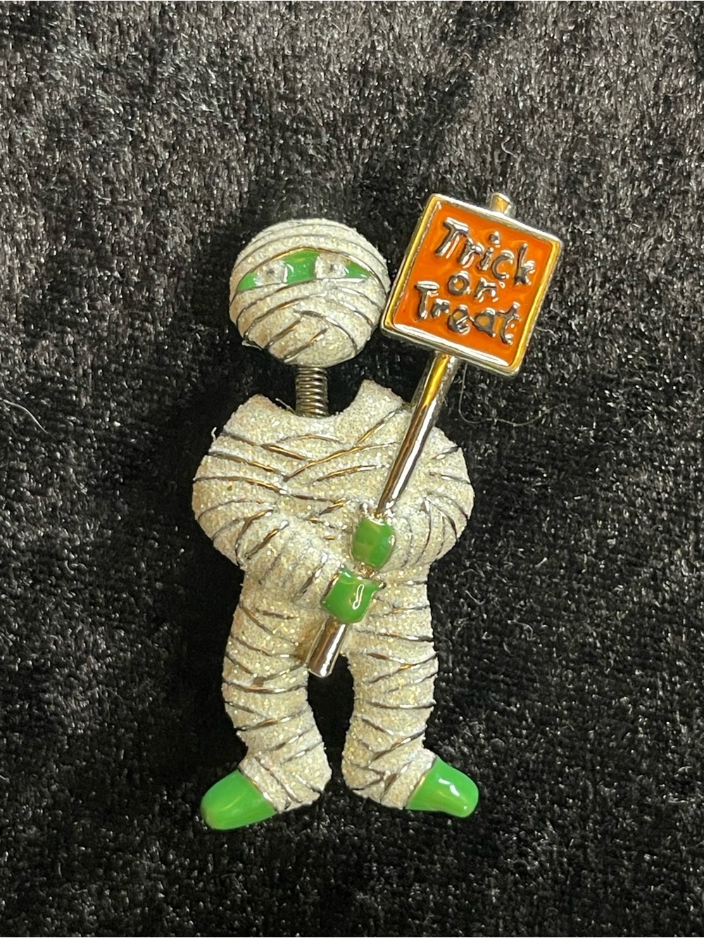 Mummy brooch